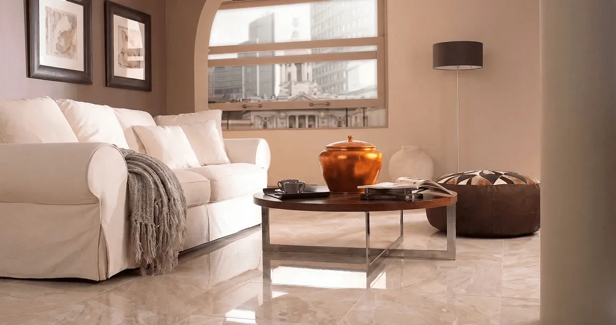 Modern living room with professionally installed marble flooring, a beige sofa, coffee table in Fort Wayne, IN
